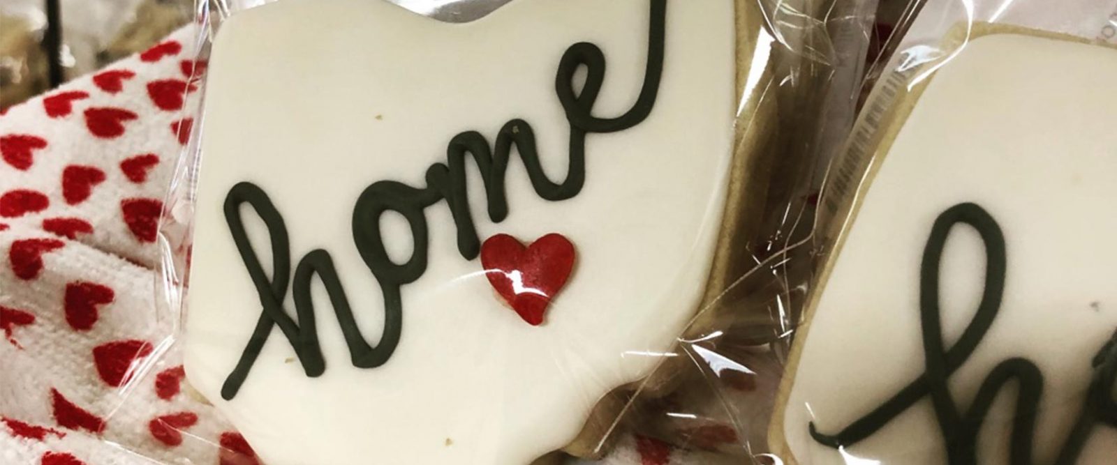 Close up of Ohio-shaped cookie with the word ‘home’ and a small heart where Lancaster is located