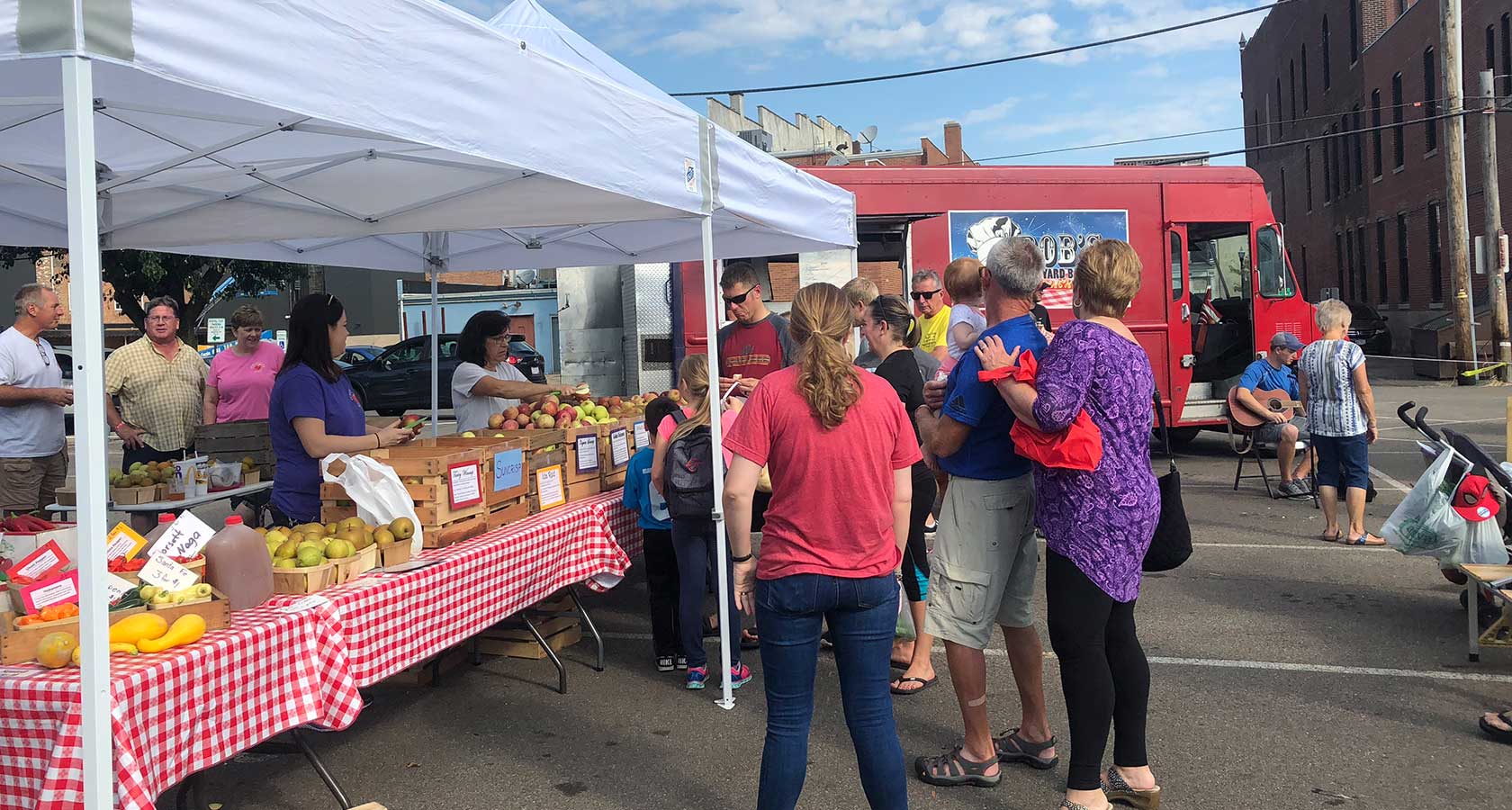 groups of people at an outdoor farmer’s market in Lancaster, ohio