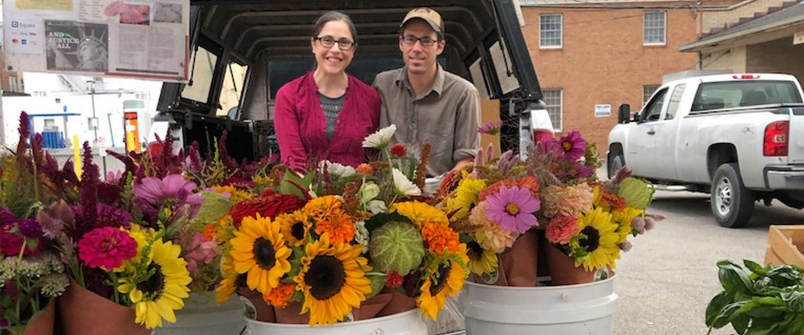 Farm couple at their flower display in the Lancaster Farmer’s Market
