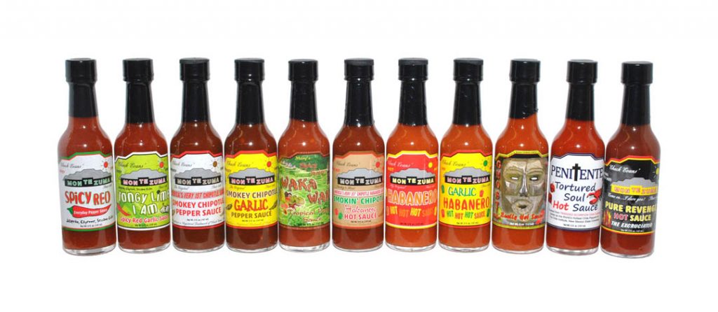 Array of a dozen Chuck Evans’ Montezuma Hot Sauces