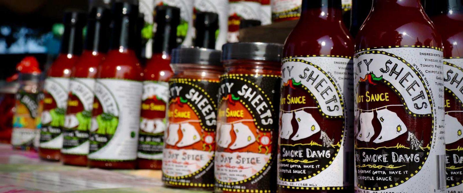 Display of a variety of hot sauces made by Ol' Dirty Sheets