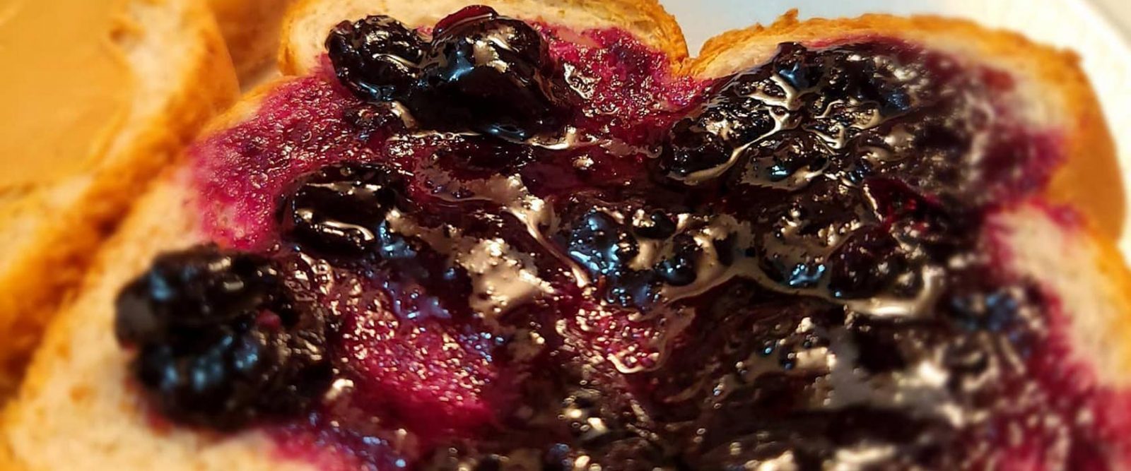 Handcrafted grape jam on a piece of bread